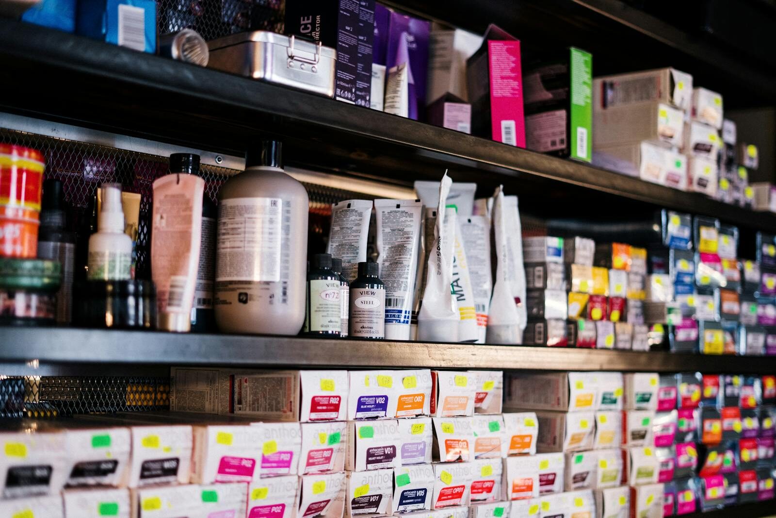 Professional hair products neatly organized on salon shelves, ideal for hairstylists.